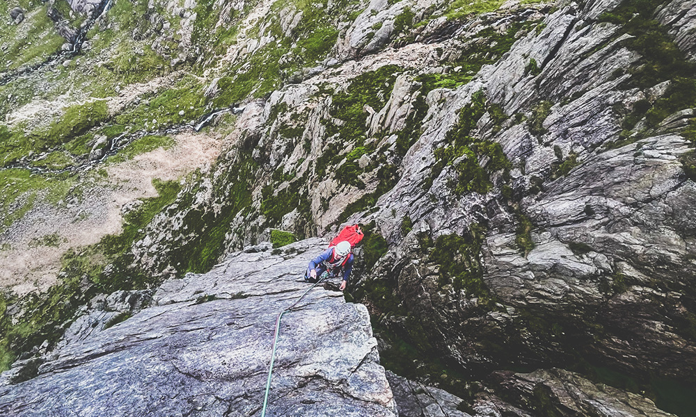 Climber on route Main Wall in North Wales