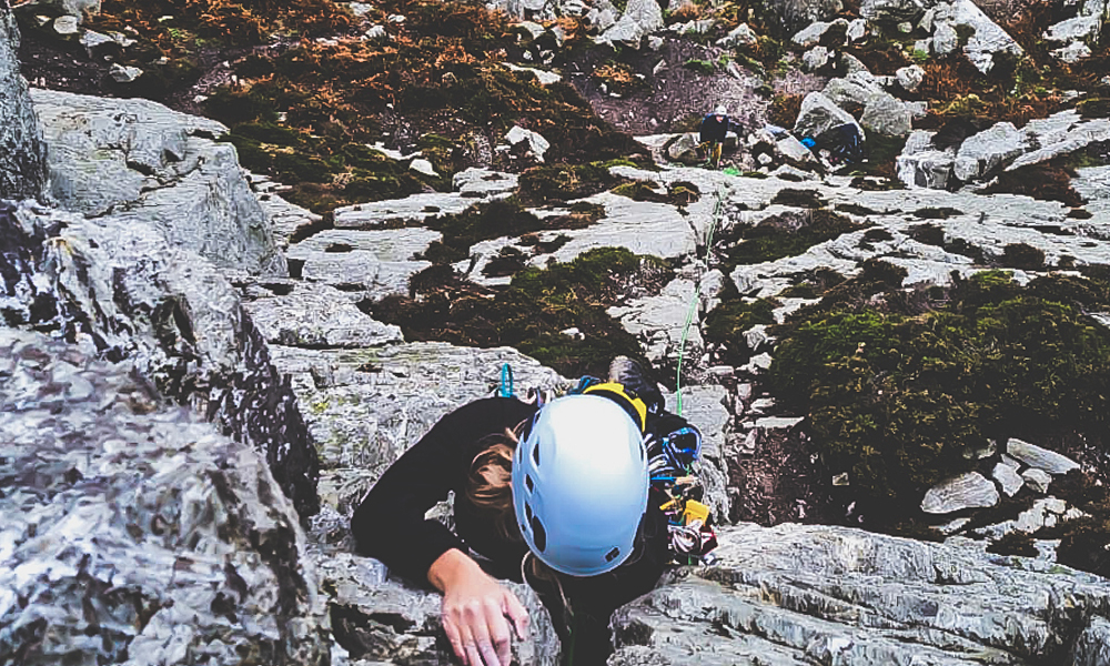 Climber leading a trad route at holyhead mountain. 