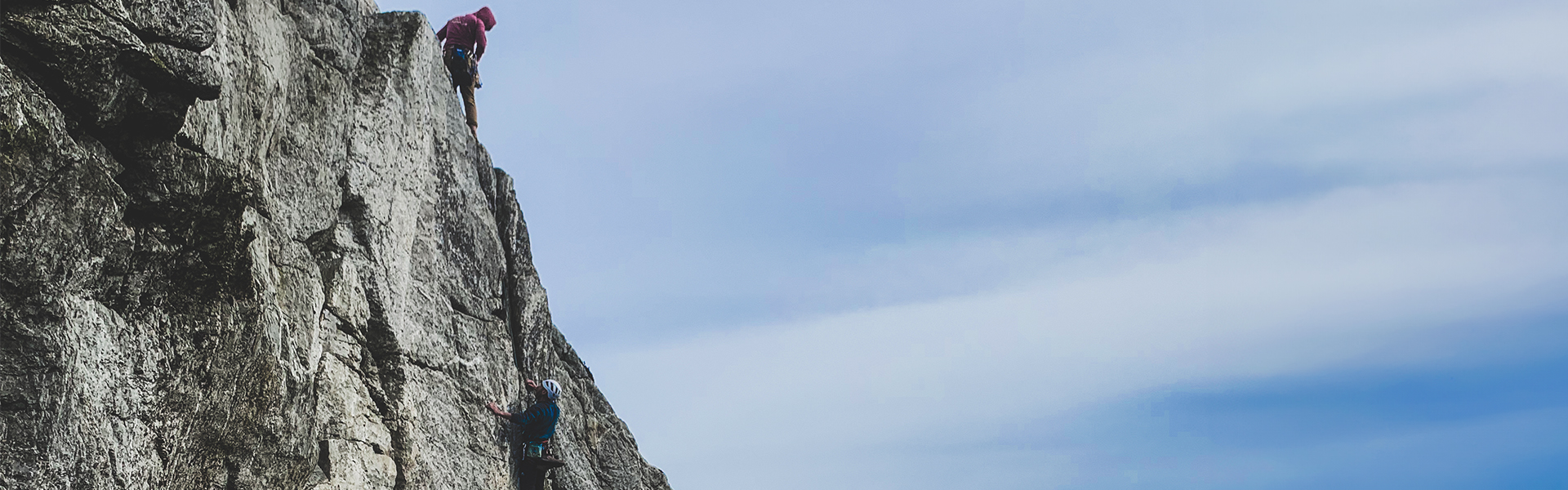 Two men climbing a route at Holyhead Mountain.