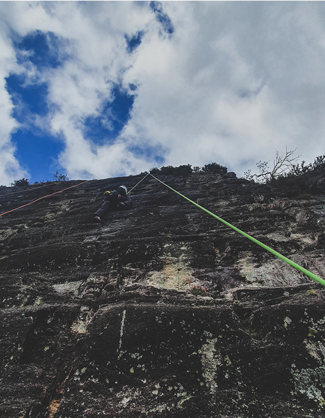 Climber getting belayed on a bottom-rope at a Crag in Betws-Y-Coed.